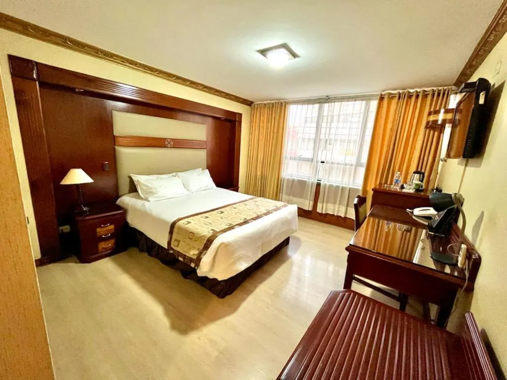 Bed in Hotel Oro Inn