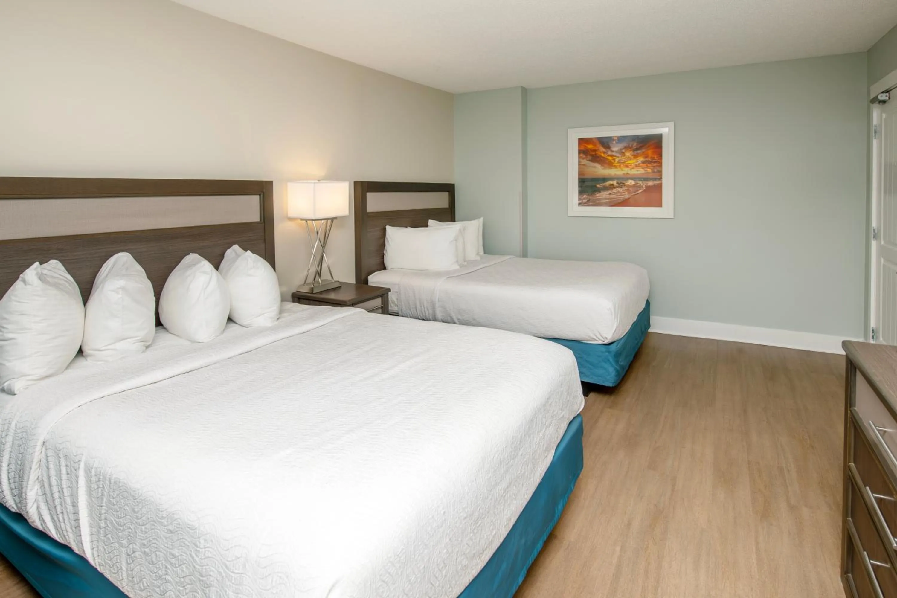 Bed in Commander Hotel & Suites