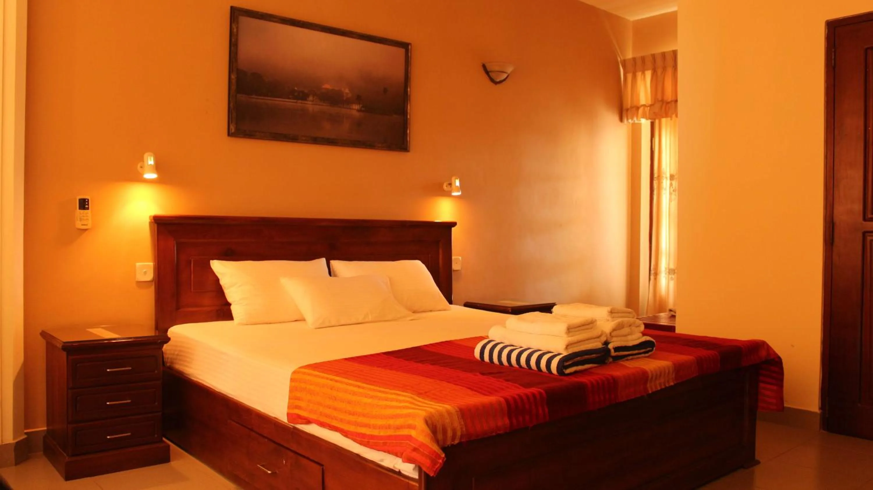 Photo of the whole room, Bed in Janishi Residencies