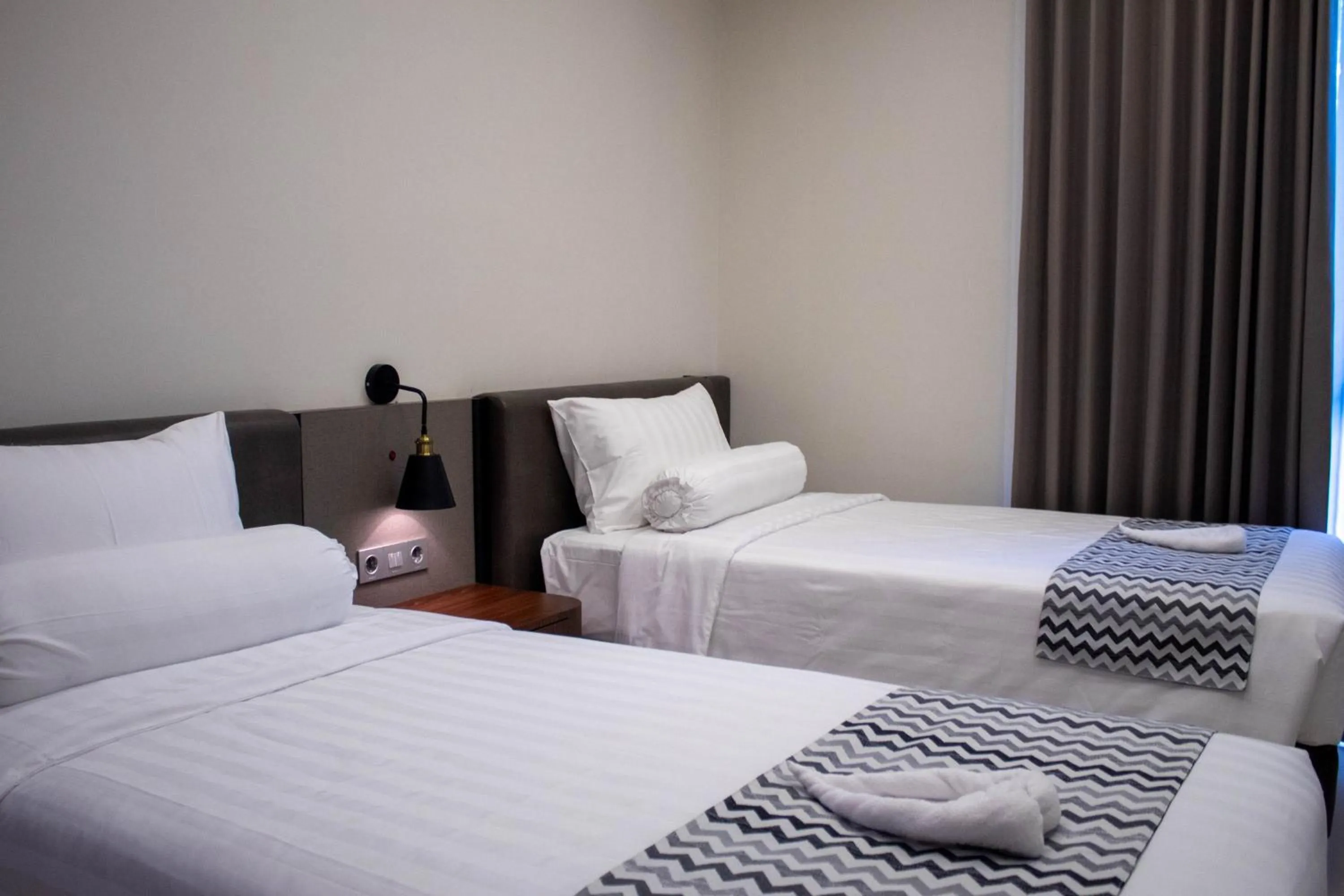 Bed in Azana Garden Hill Resort Blora