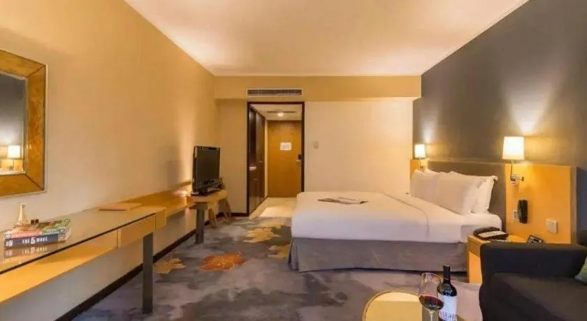 Bed in Beijing New World Center Tongpai Hotel