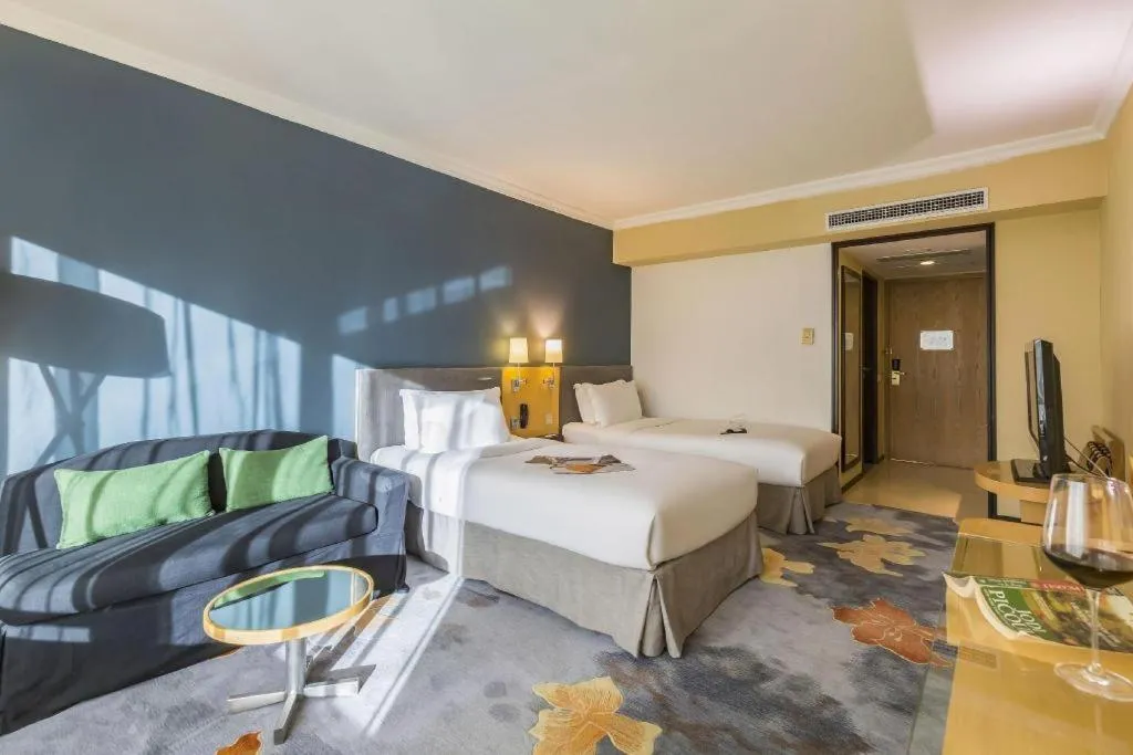 Bed in Beijing New World Center Tongpai Hotel