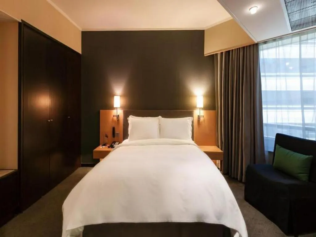 Bed in Beijing New World Center Tongpai Hotel