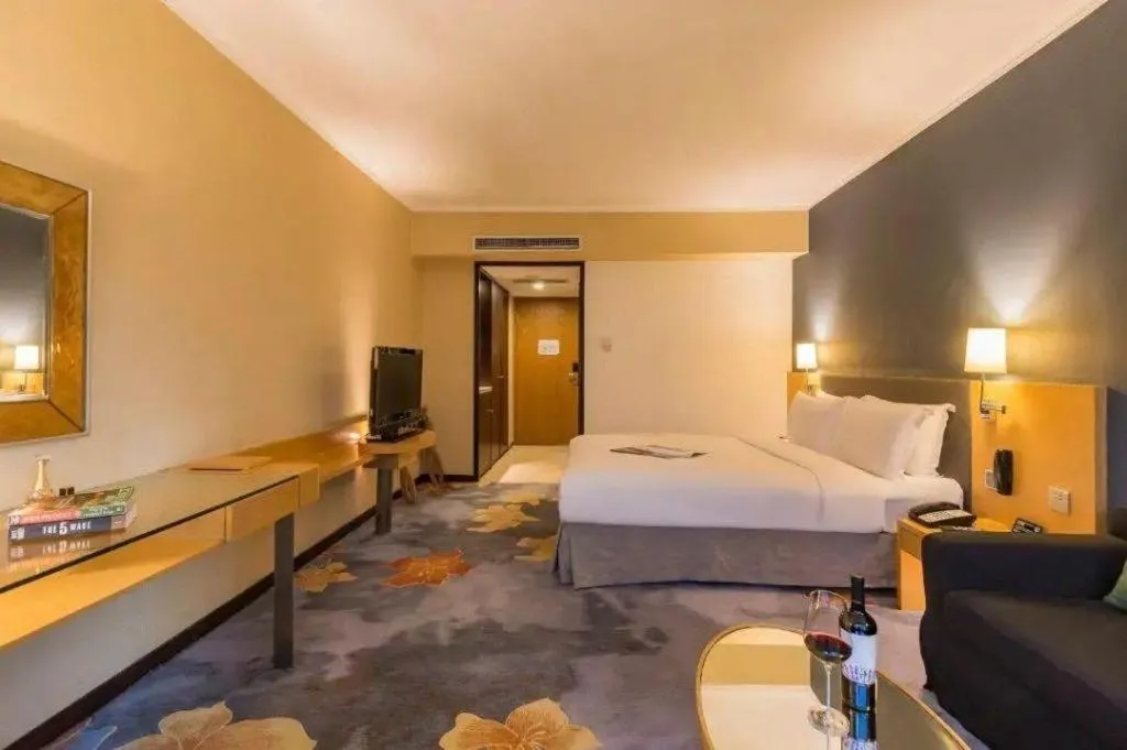 Bed in Beijing New World Center Tongpai Hotel