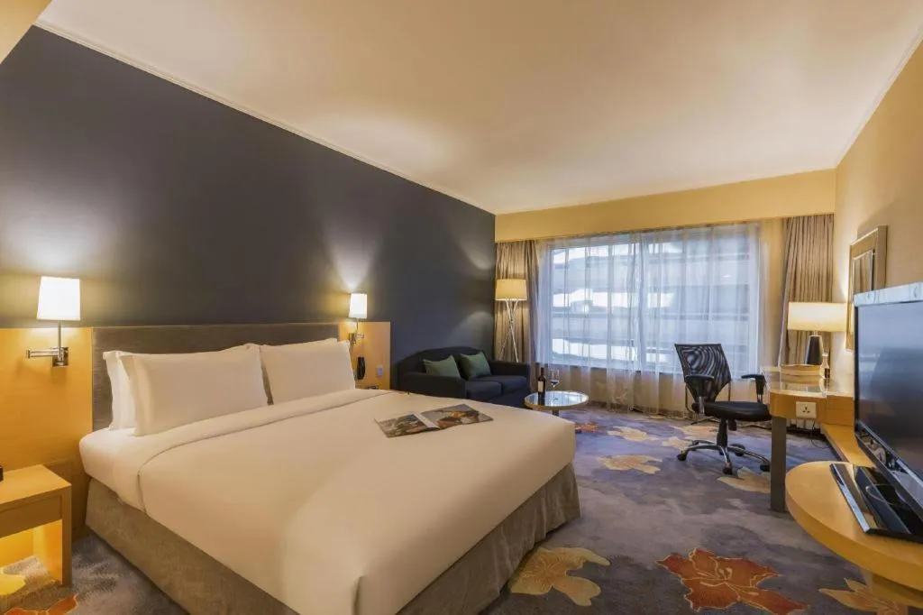 Bed in Beijing New World Center Tongpai Hotel