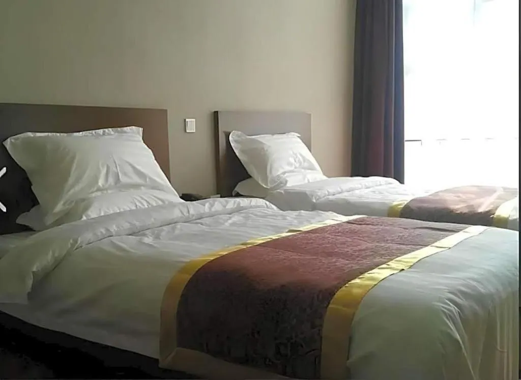 Bed in Beijing Jinjiang Fuyuan Hotel