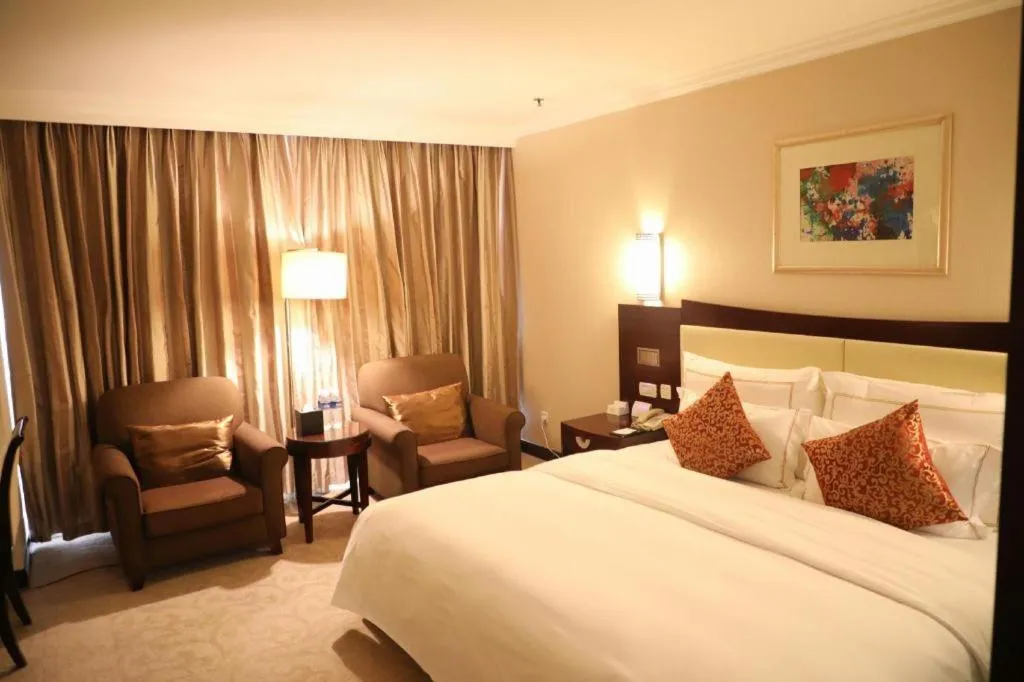 Bed in Beijing Jinjiang Fuyuan Hotel