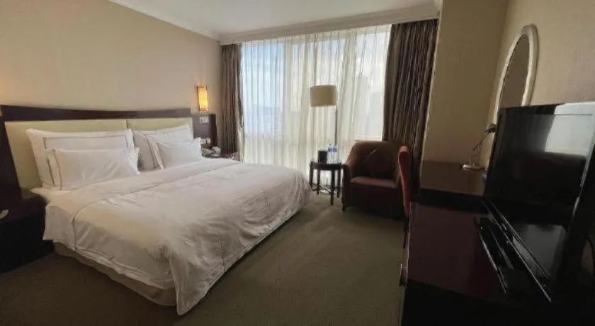 Bed in Beijing Jinjiang Fuyuan Hotel