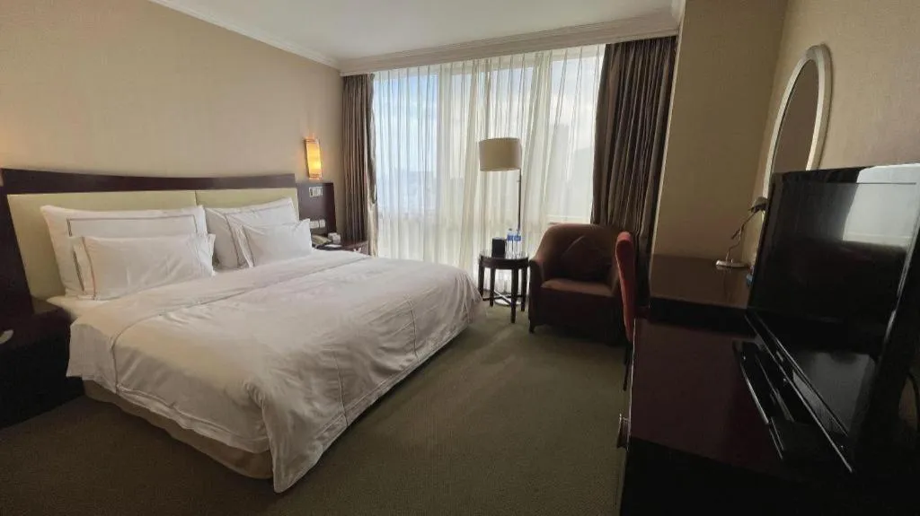 Bed in Beijing Jinjiang Fuyuan Hotel