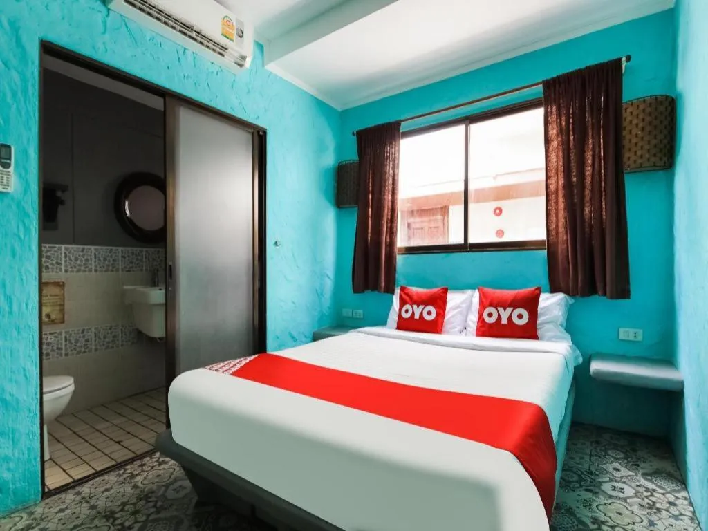 Bed in OYO 1103 Pirates House Hotel