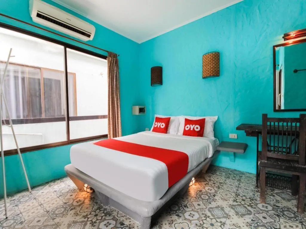 Bed in OYO 1103 Pirates House Hotel