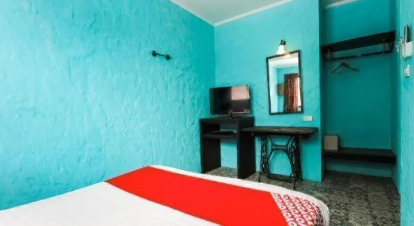 Bed in OYO 1103 Pirates House Hotel