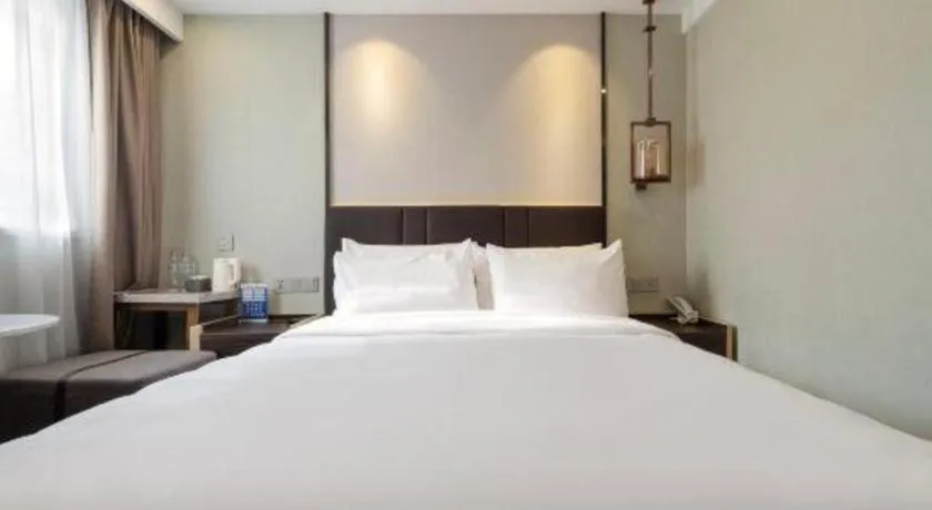 Bed in Magnotel Shanghai Maglev Station