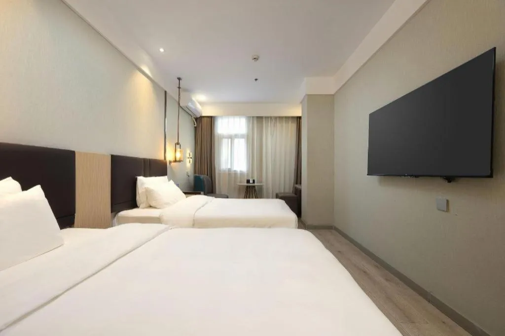 Bed in Magnotel Shanghai Maglev Station