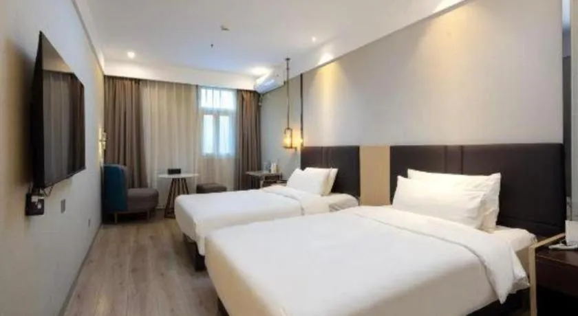 Bed in Magnotel Shanghai Maglev Station