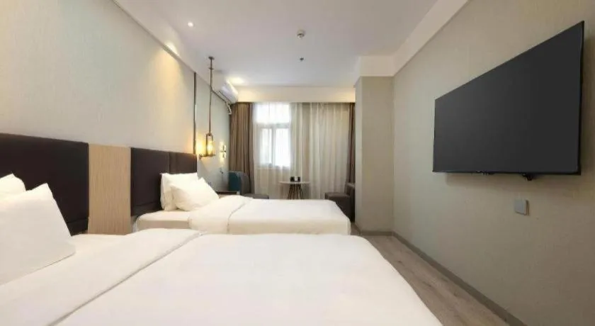 Bed in Magnotel Shanghai Maglev Station