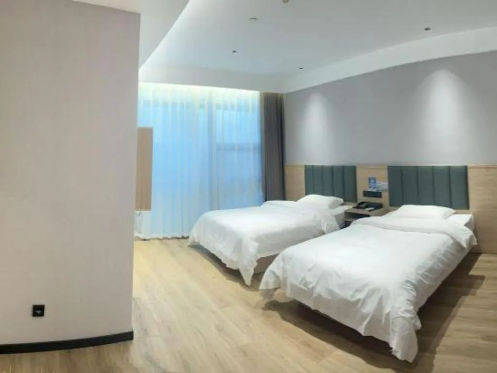 Bed in GreenTree Inn Suzhou Shengze Hotel