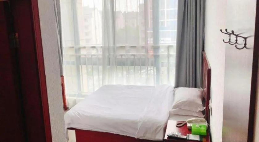 Bed in GreenTree Inn Suzhou Shengze Hotel