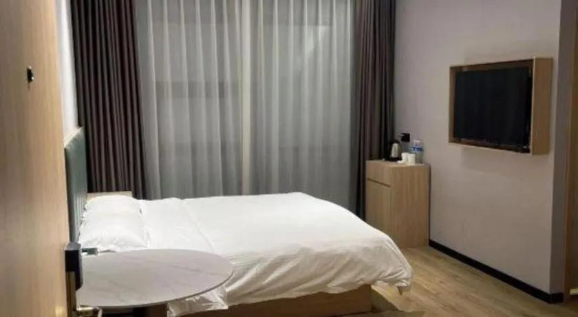 Bed in GreenTree Inn Suzhou Shengze Hotel