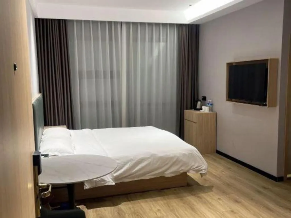 Bed in GreenTree Inn Suzhou Shengze Hotel