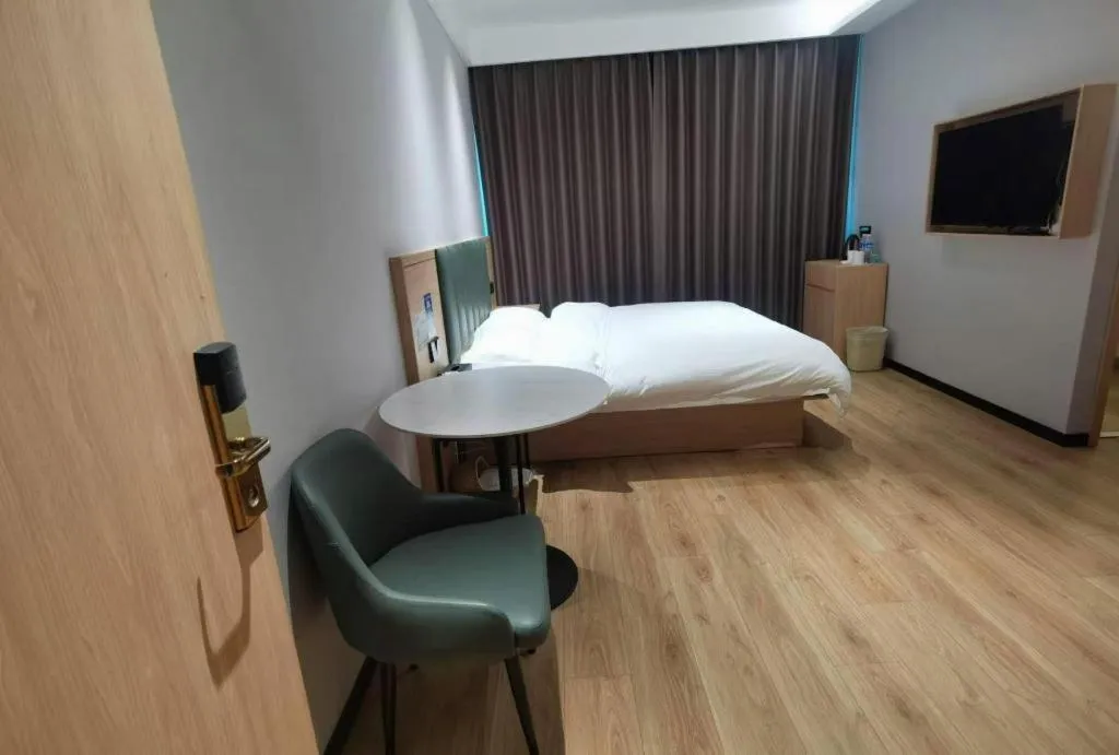 Bed in GreenTree Inn Suzhou Shengze Hotel