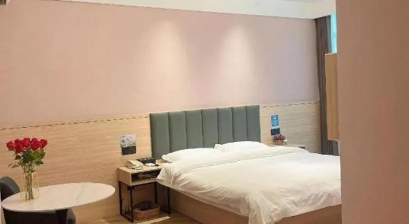 Bed in GreenTree Inn Suzhou Shengze Hotel