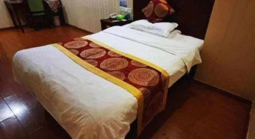 Bed in GreenTree Inn Suzhou Shengze Hotel