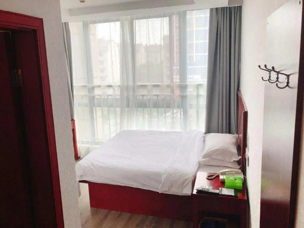 Bed in GreenTree Inn Suzhou Shengze Hotel