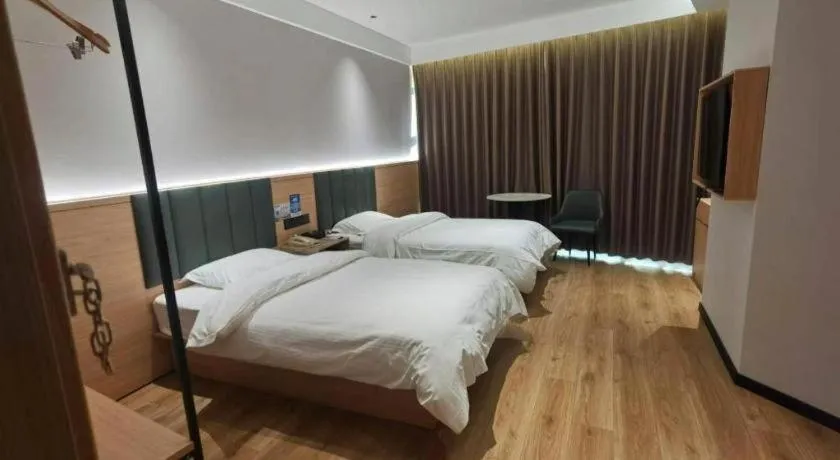 Bed in GreenTree Inn Suzhou Shengze Hotel