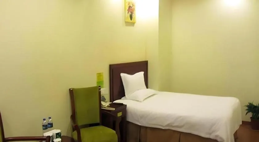 Bed in GreenTree Inn Suzhou Shengze Hotel