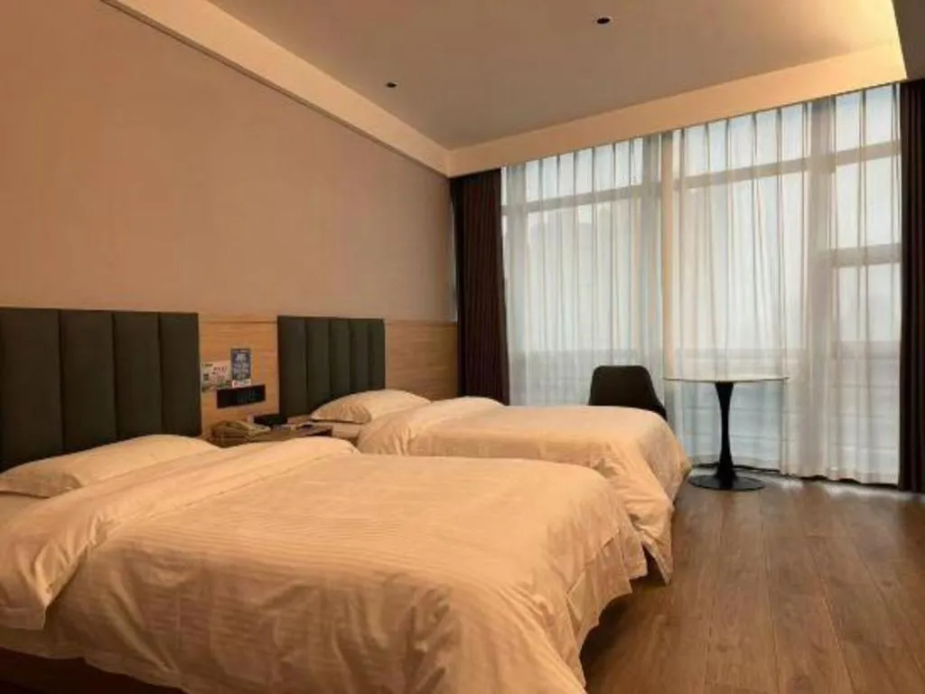 Bed in GreenTree Inn Suzhou Shengze Hotel