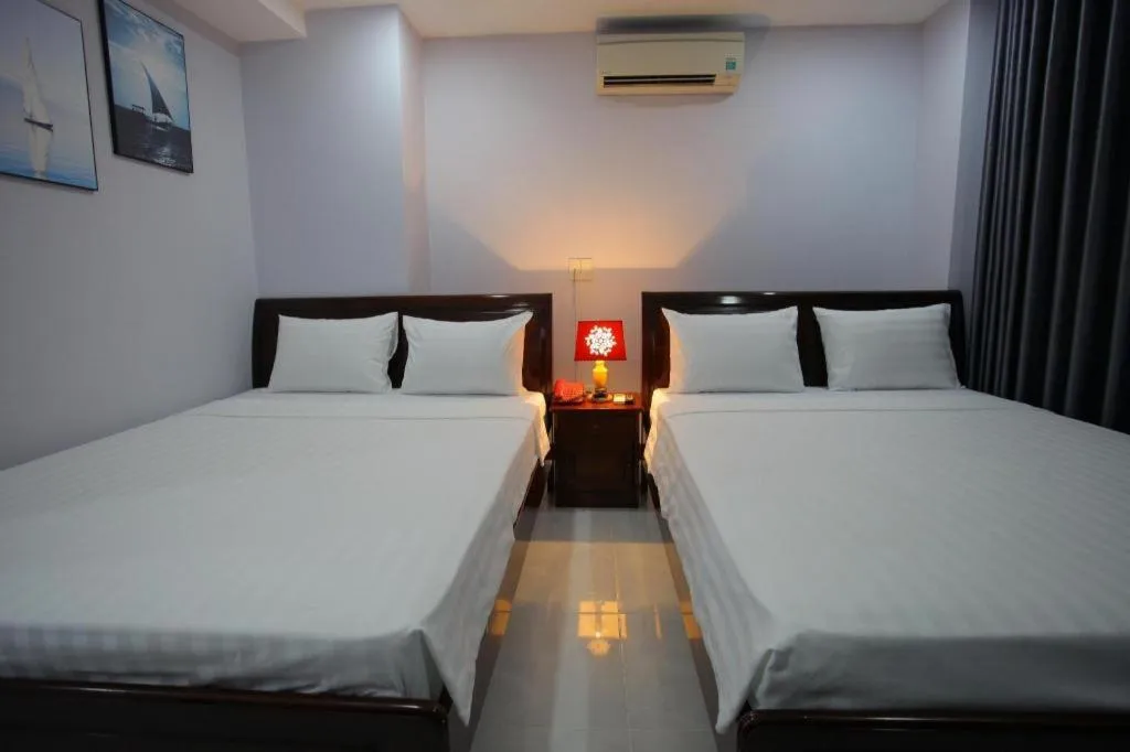 Bed in Nhatrang Cozy Hotel