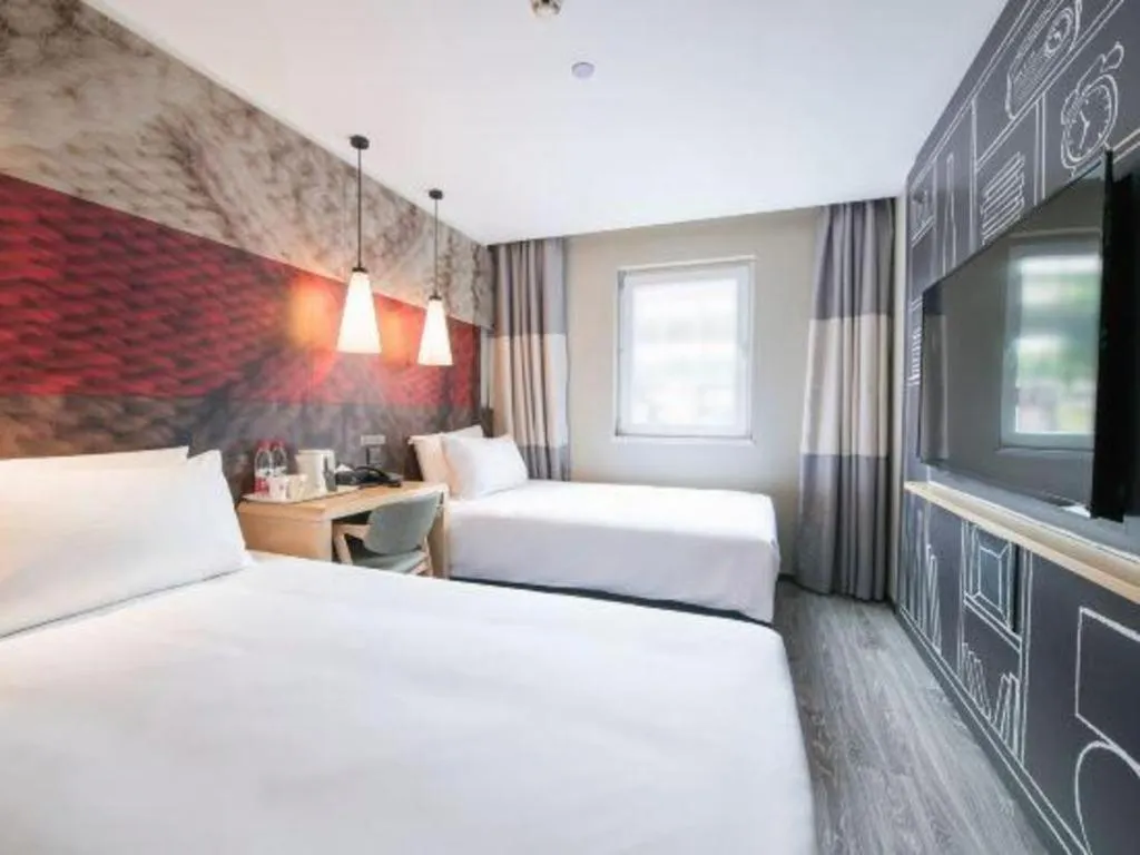 Bed in Ibis Chengdu Yongfeng Hotel
