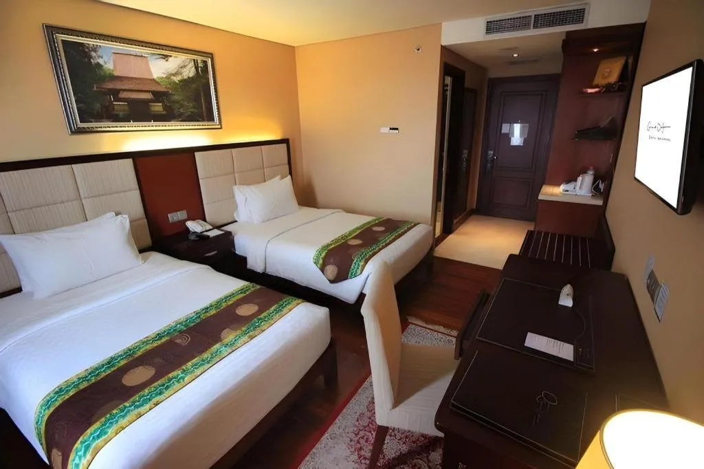 Bed in Grand Qin Hotel Syariah