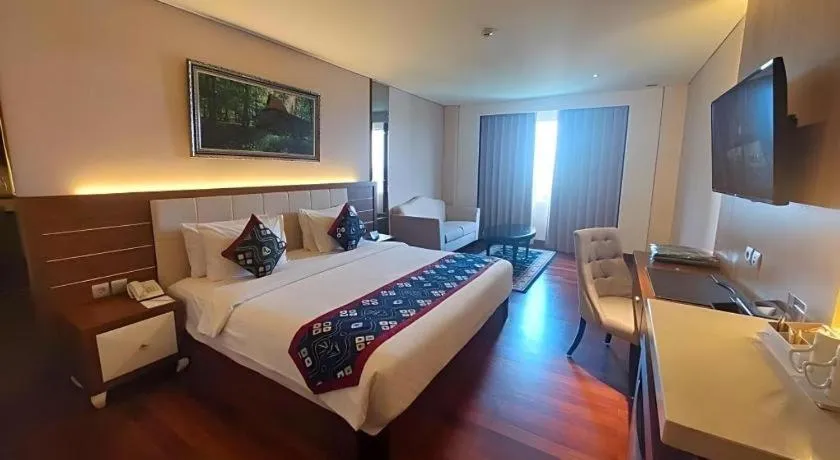 Bed in Grand Qin Hotel Syariah