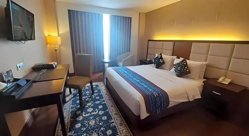 Bed in Grand Qin Hotel Syariah