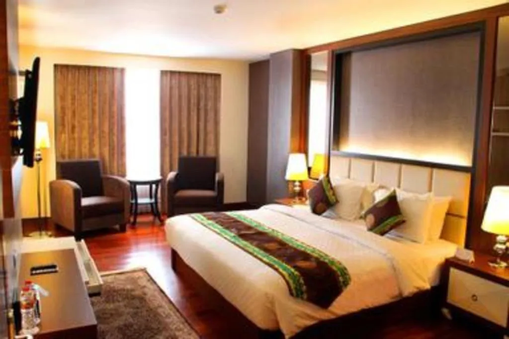 Bed in Grand Qin Hotel Syariah