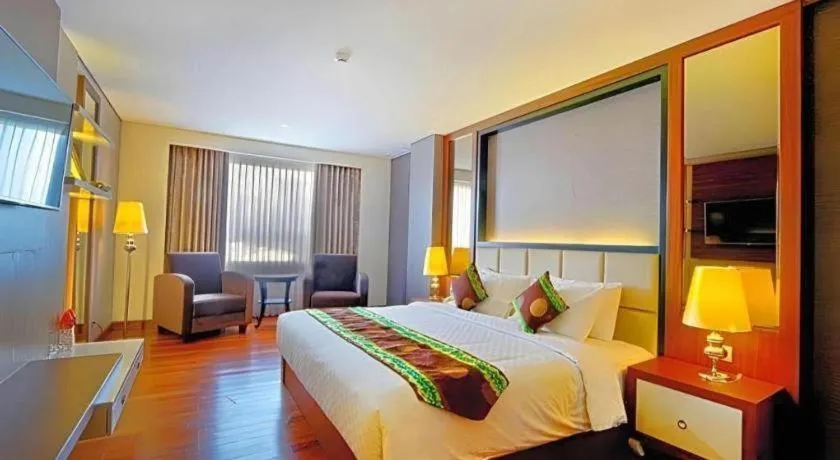 Bed in Grand Qin Hotel Syariah