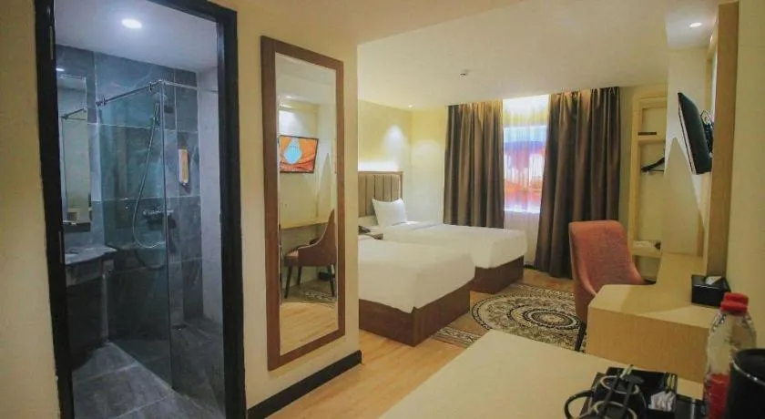 Bed in Grand Qin Hotel Syariah