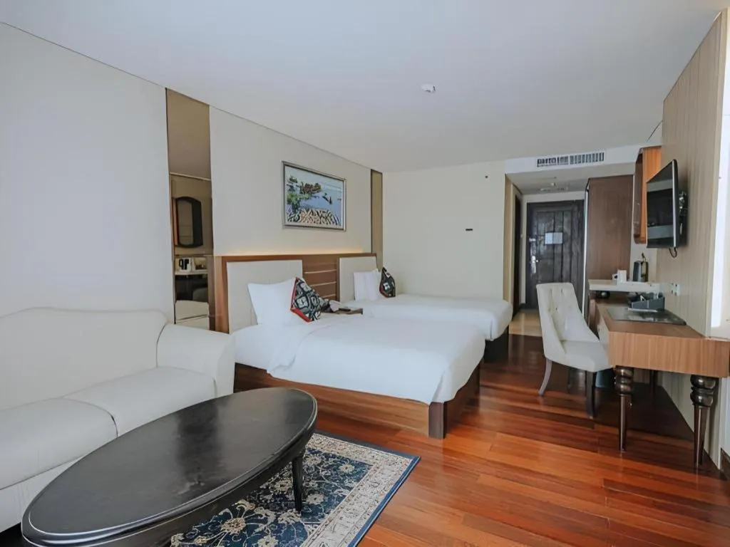 Bed in Grand Qin Hotel Syariah