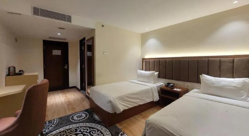 Bed in Grand Qin Hotel Syariah