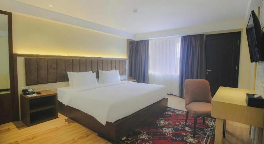 Bed in Grand Qin Hotel Syariah