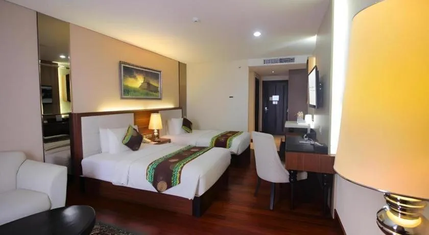 Bed in Grand Qin Hotel Syariah