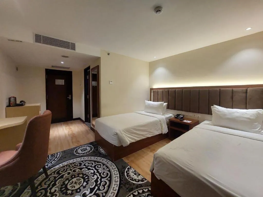 Bed in Grand Qin Hotel Syariah