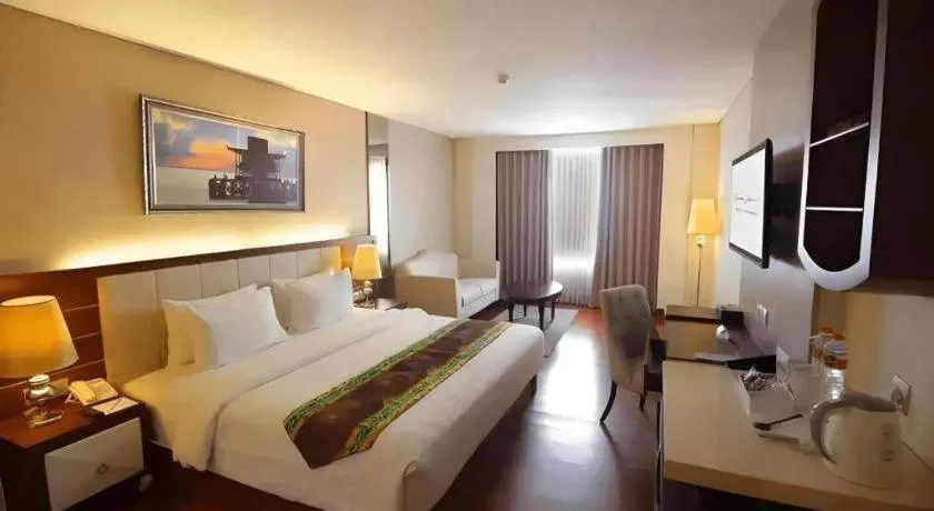 Bed in Grand Qin Hotel Syariah