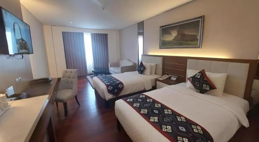 Bed in Grand Qin Hotel Syariah