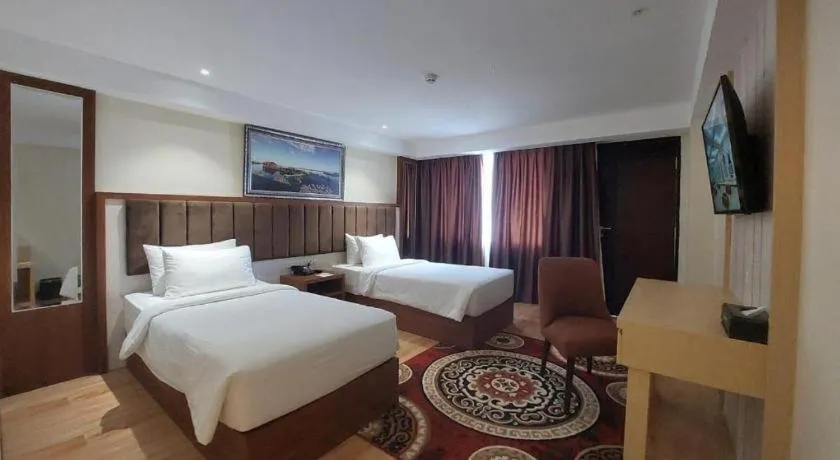 Bed in Grand Qin Hotel Syariah