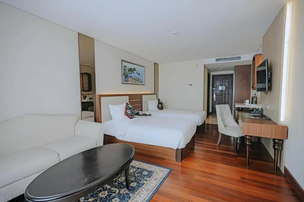 Bed in Grand Qin Hotel Syariah