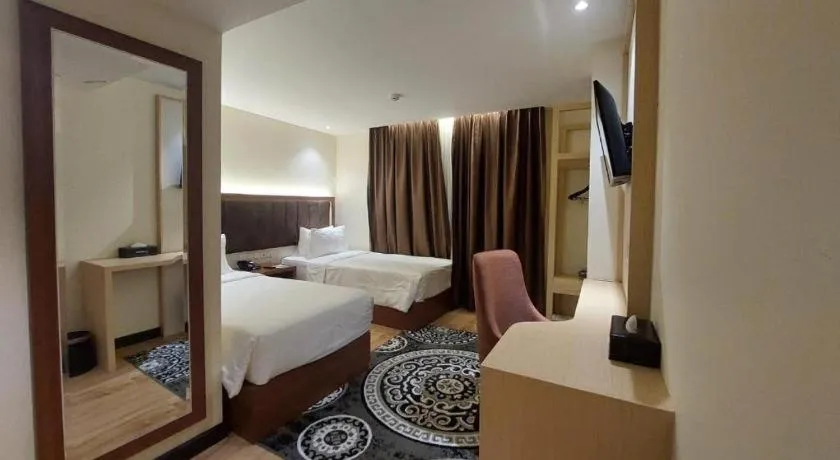 Bed in Grand Qin Hotel Syariah
