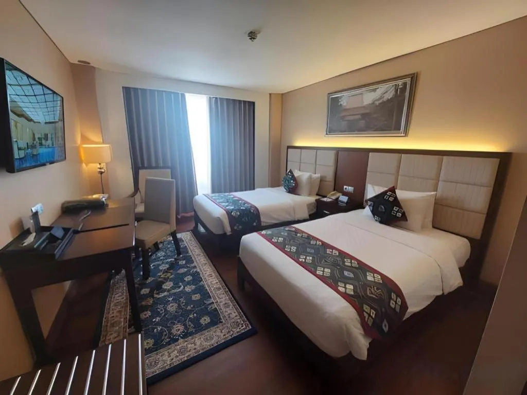 Bed in Grand Qin Hotel Syariah